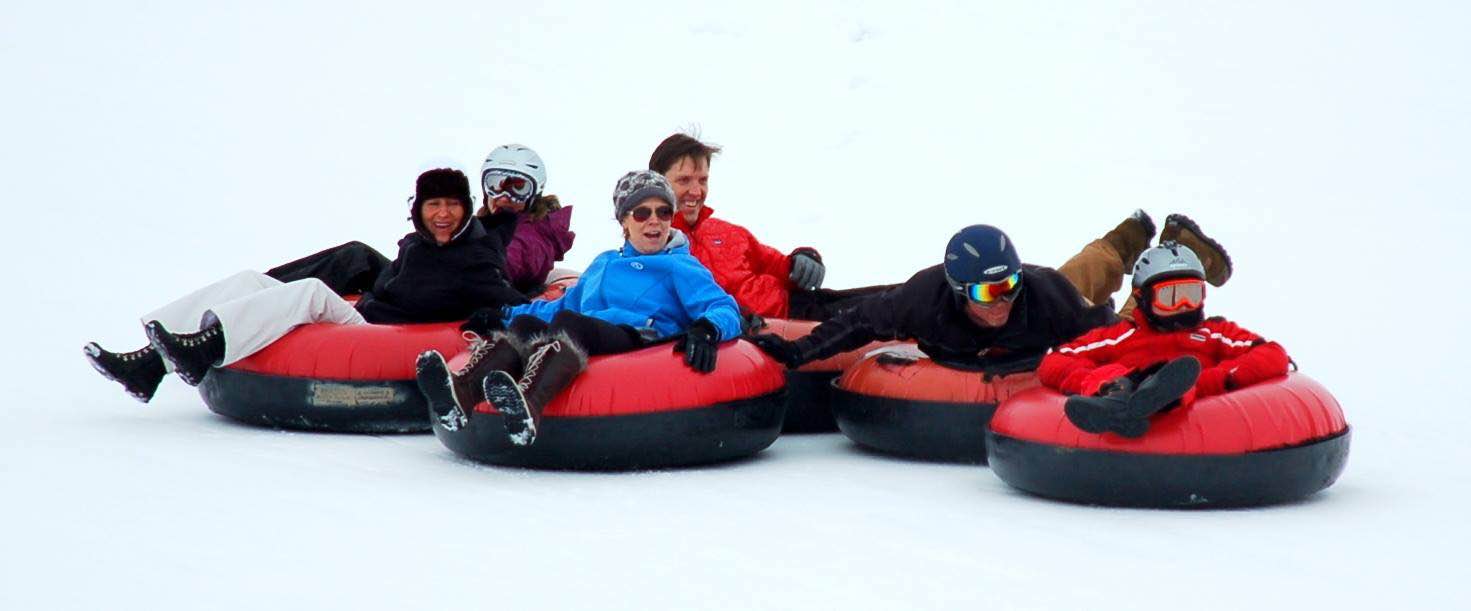 Group holding their inner-tubes together Saddleback Ranch Tubing Hill