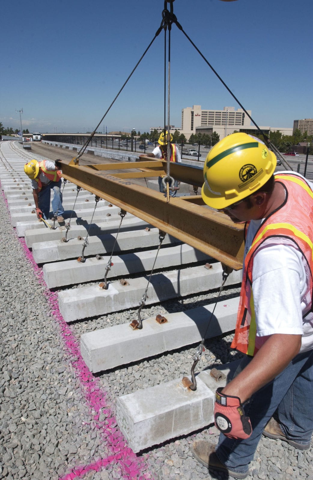 RTD Train Installing Railroad Tie