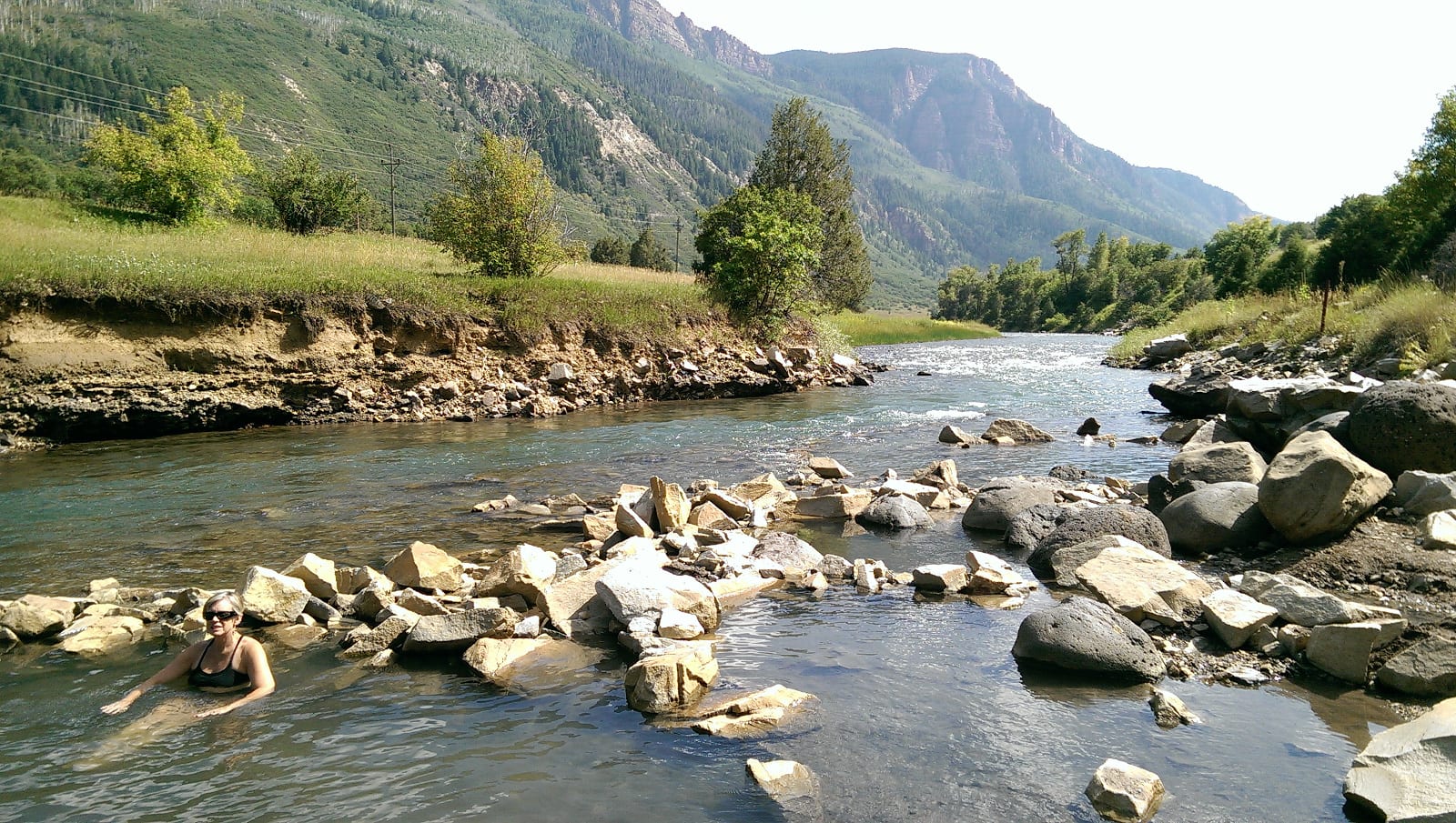 looking downstream at the riverside Penny Hot Springs in Western Colorado
