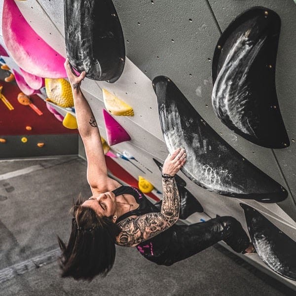 image of woman bouldering
