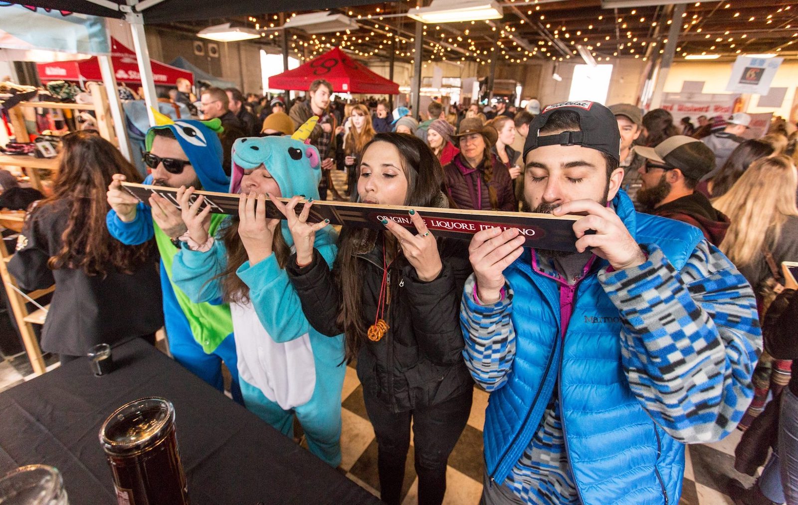 Image of people doing a ski shot at the Mile High Beer Festival in Denver