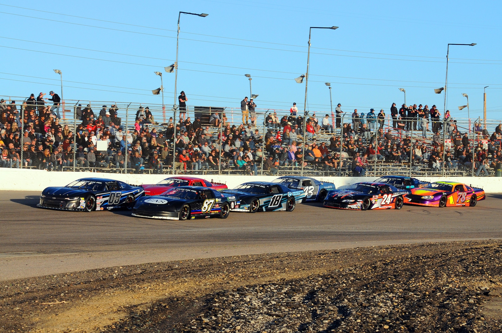 Image of cars racing at the Colorado National Speedway in Colorado