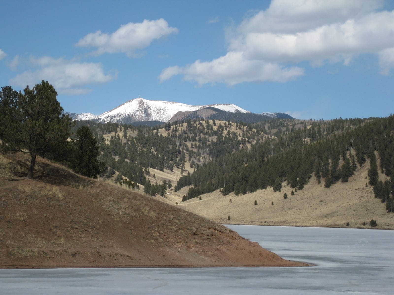 Skaguay Reservoir Frozen in April Pikes Peak in Distance