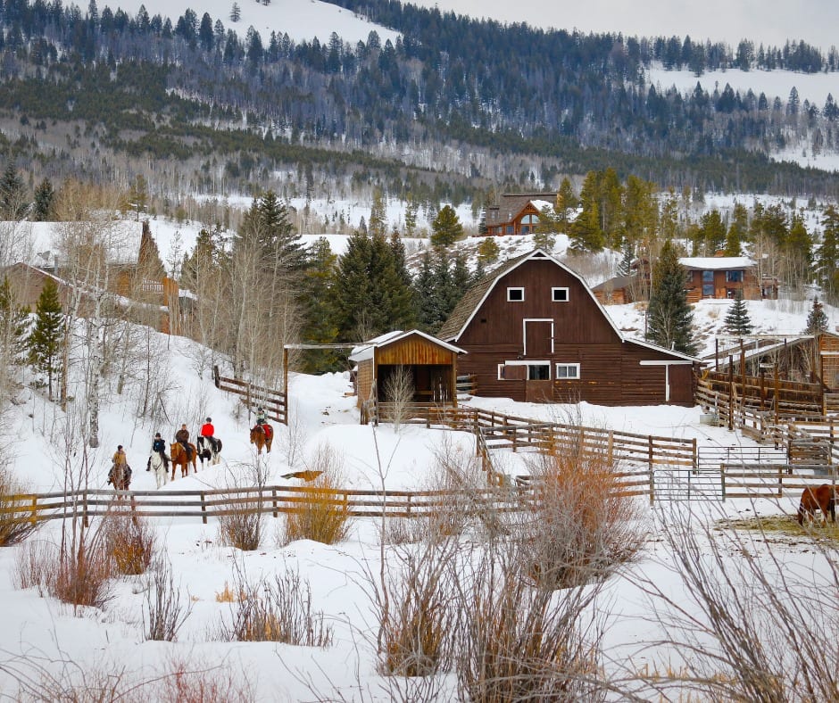Image of people horseback riding in the snow at C Lazy U Ranch, CO