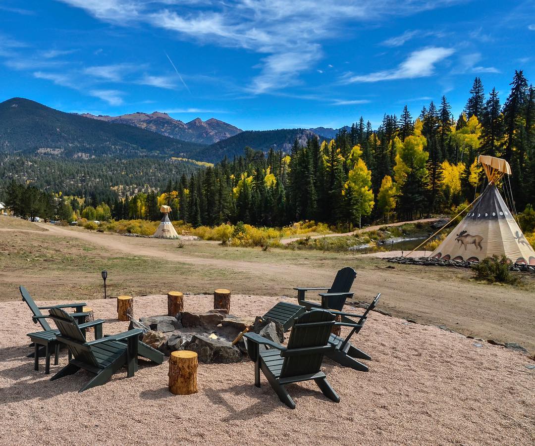 Image of the a fire pit and tipi at Bison Peak Lodge at Puma Hills in Colorado.