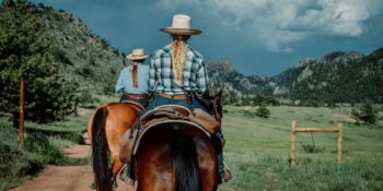 Image of two women riding horses at Cherokee Park Ranch in Colorado