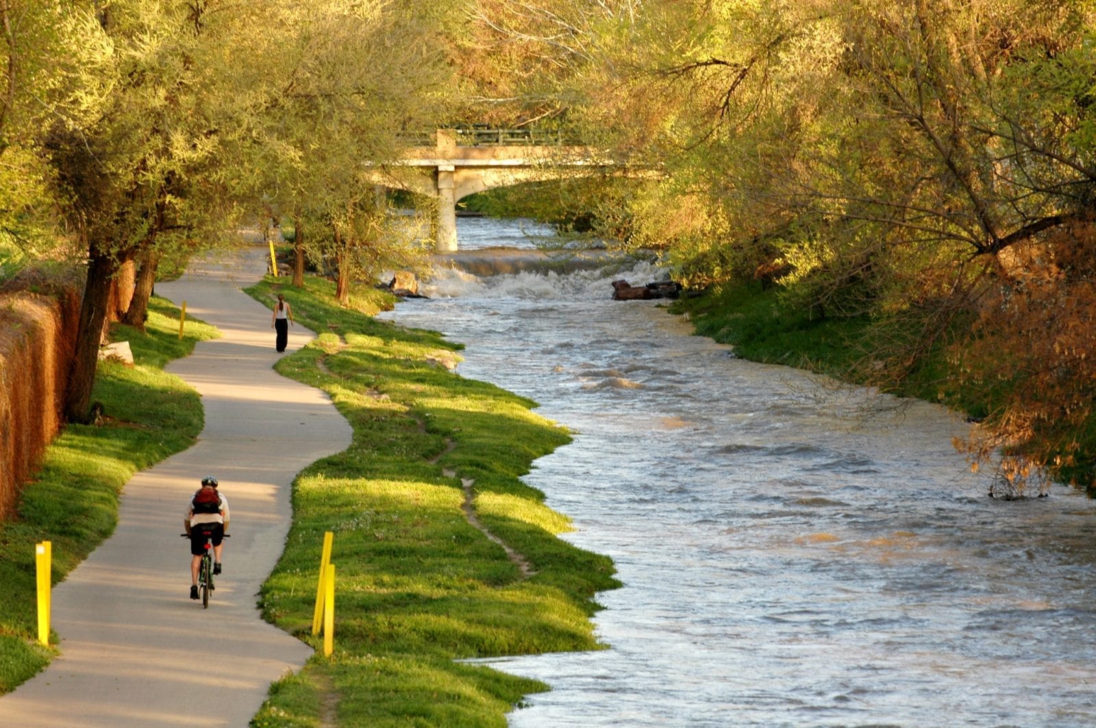 Image of a biker next to the Cherry Creek in Colorado