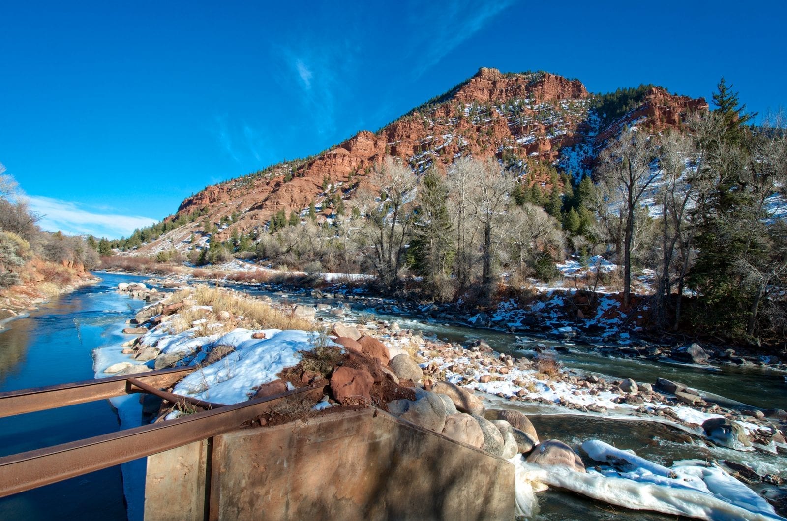 Image of the Eagle River in Colorado with a mountain in the background and snow