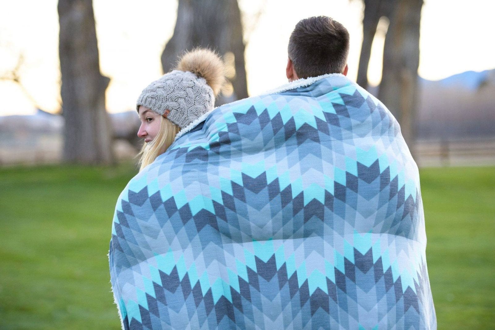 Image of a couple with a Holden & Hay blanket around them