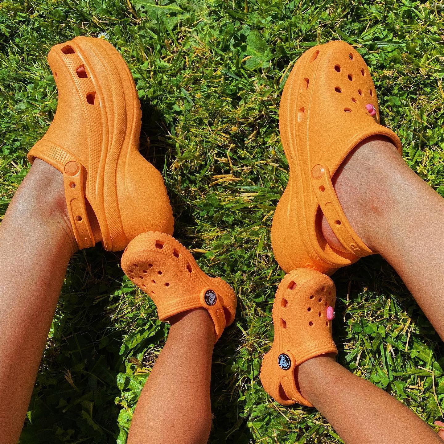 Image of a parent and child in matching crocs