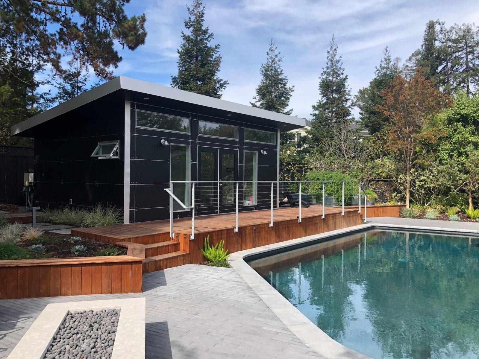 Image of a black Studio Shed Poolside