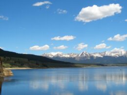 Image of the Taylor River with mountains in the background in Colorado