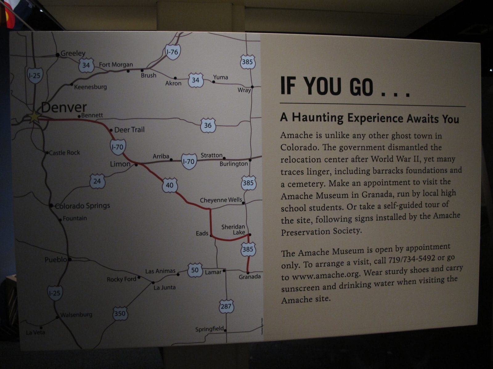 Image of a sign explaining how to get a tour at the Amache Museum in Colorado