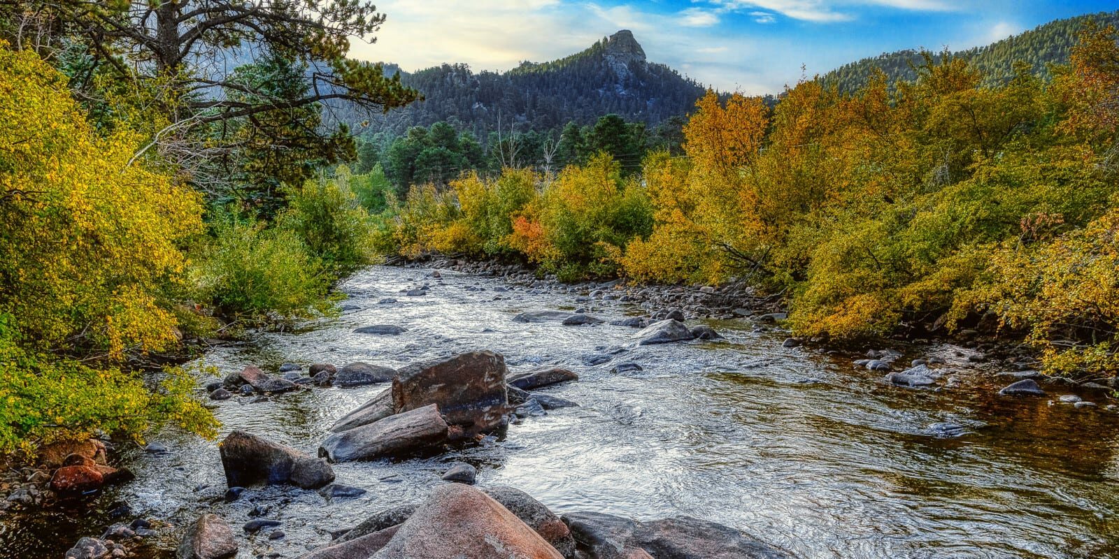 Image of the Big Thompson River surrounded by fall folliage