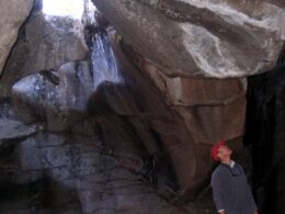 Image of a man in a cavern on the Grottos Trail in Aspen, Colorado