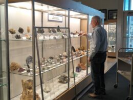 Image of a man installing an exhibit at the Mines Museum in Golden, Colorado