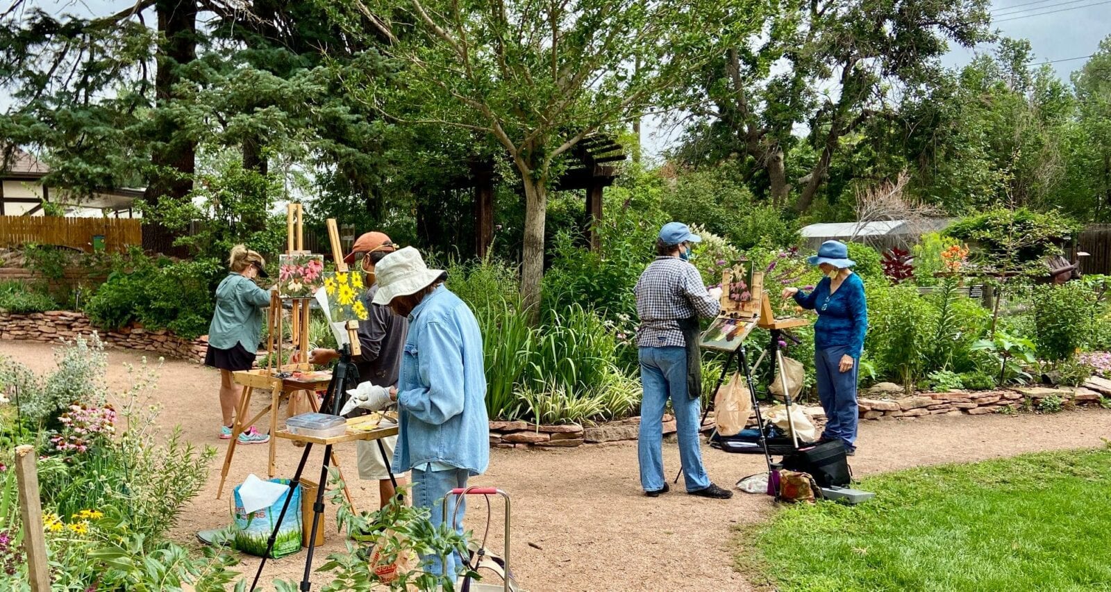 Image of painters in the horticultural art society of colorado springs "demo garden" at Monument Valley Park in Colorado Springs, Colorado