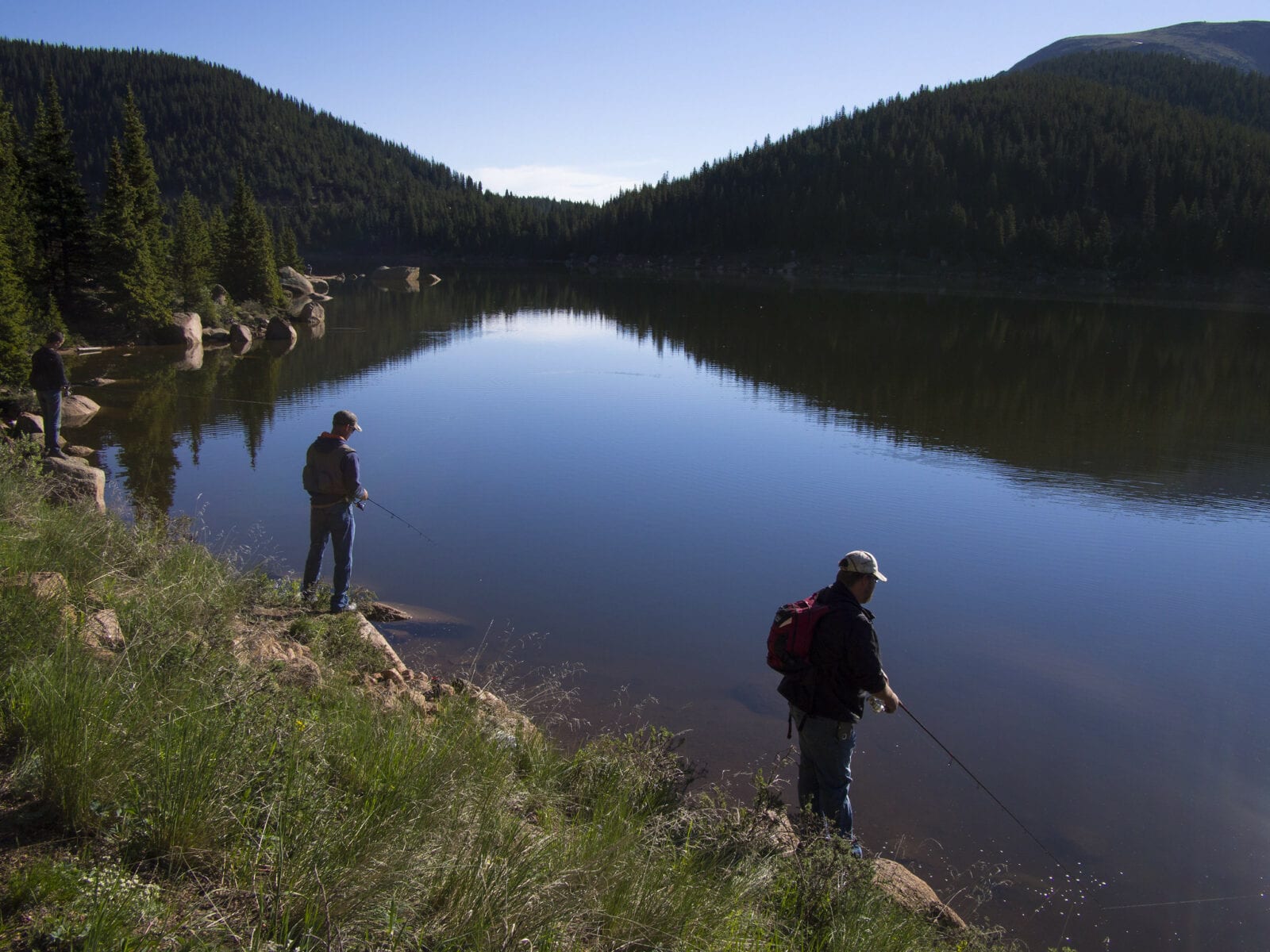 Image of two men fishing on the mason reservoir in pikes peak south slope recreation area