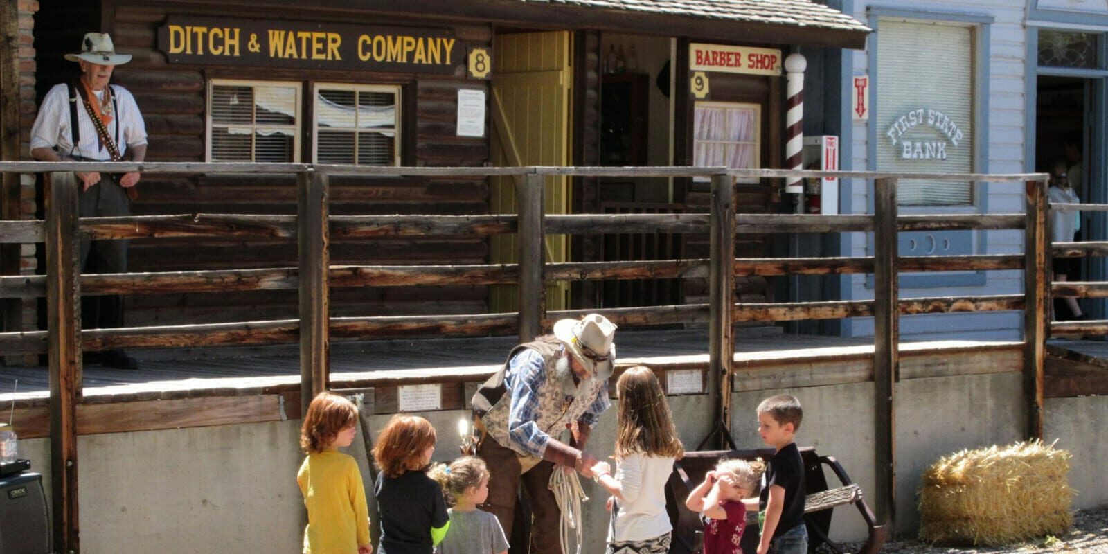 Image of a actor in the Pioneer Town Museum in Cedaredge teaching kids