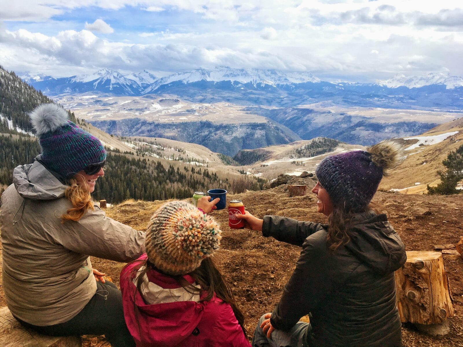 Image of three woman enjoying a drink at the end of a hike in Smeeny Beanie Knits