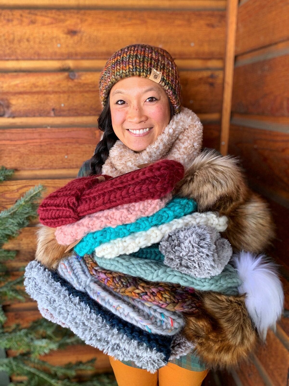 Image of Chereen, the owner, showing off her Smeeny Beanie Knit hats