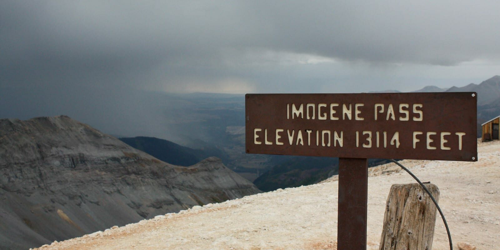 Image of the Imogene Pass elevation sign in Colorado