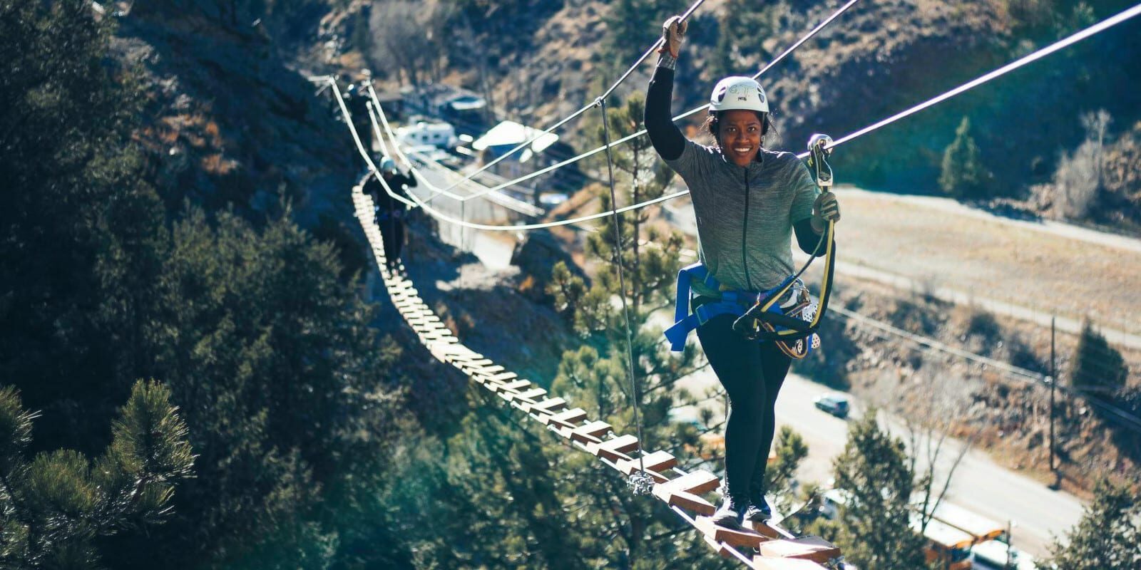 Image of a woman on a bridge on the Mount Evans Via Ferrata in Idaho Springs, Colorado