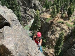 Image of a woman climbing the Ouray Via Ferrata in Colorado