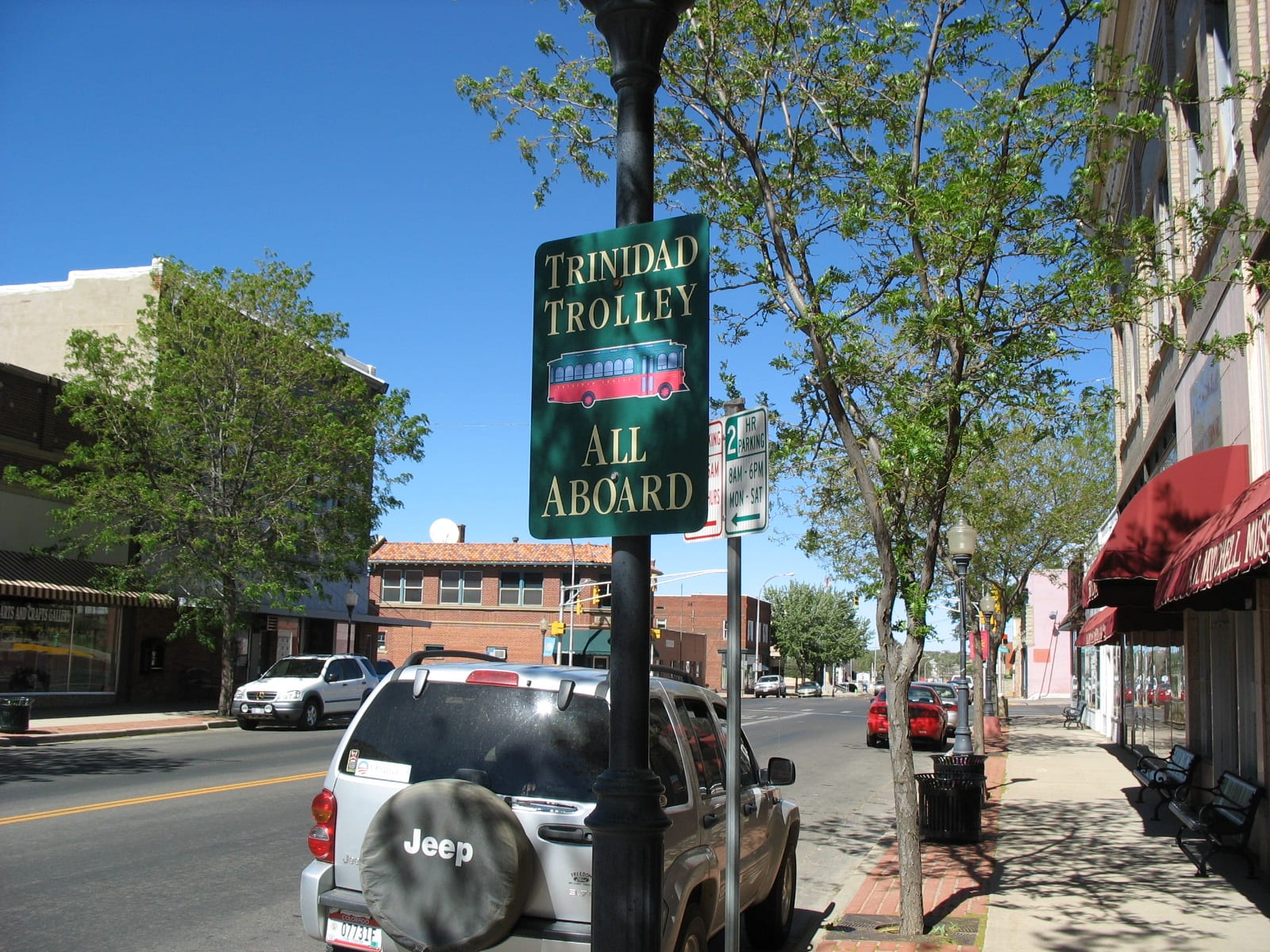 Image of the Trinidad Trolley sign saying "All Aboard" in Colorado