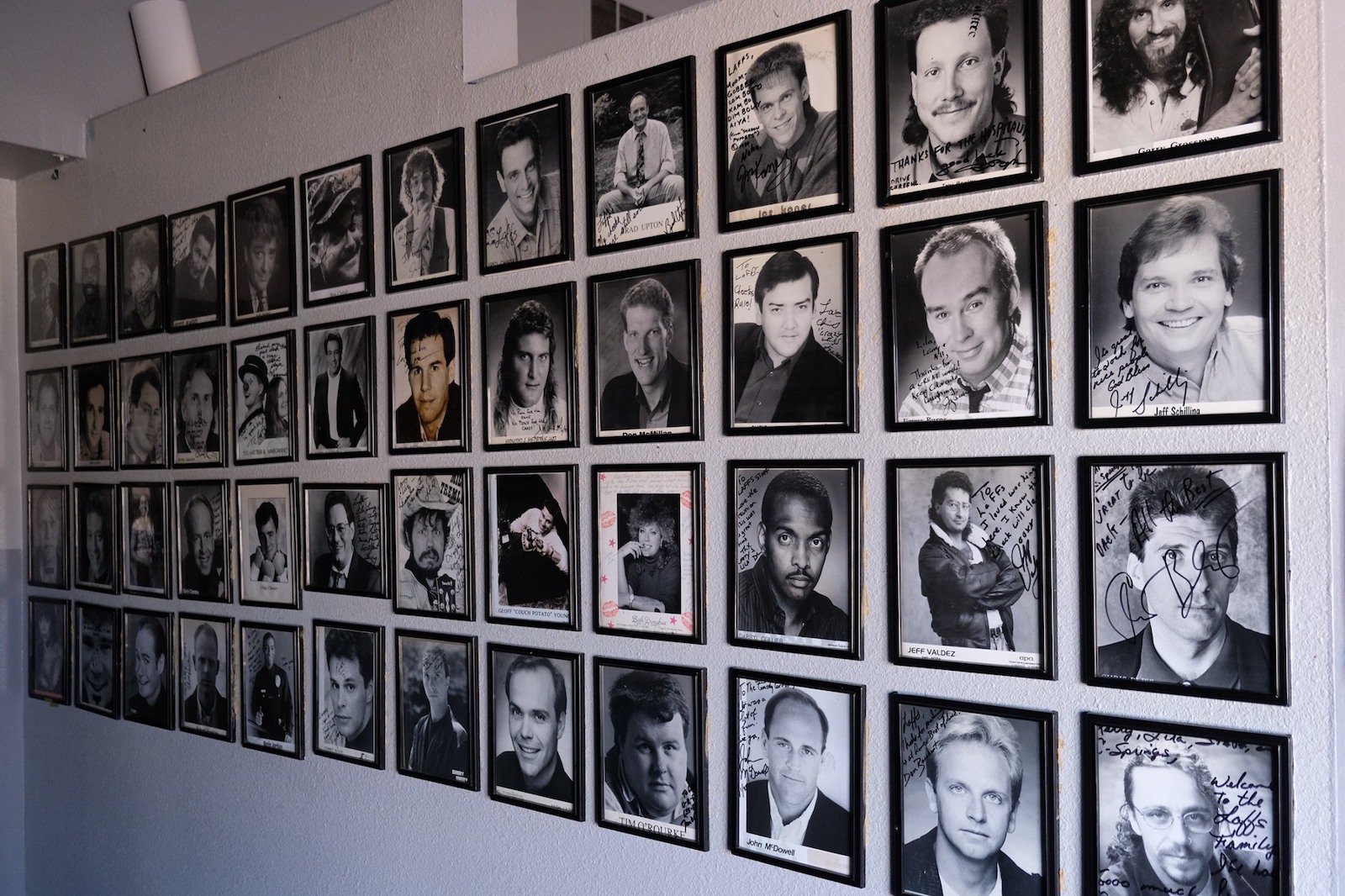 Image of autographed photos at Loonees Comedy Corner in Colorado Springs, Colorado