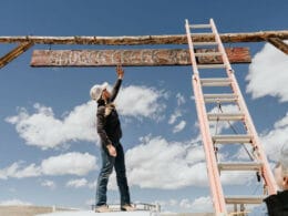 Image of the Badger Creek Ranch sign being painted