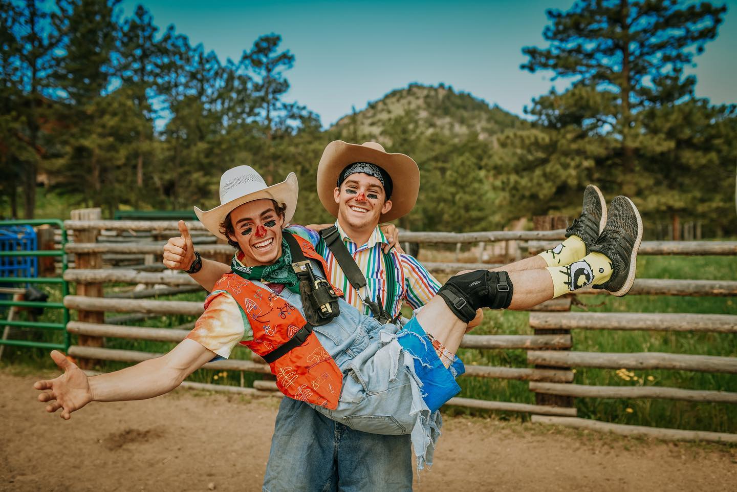 Image of two ranch hands clowning around at Cherokee Park Ranch in Livermore, Colorado