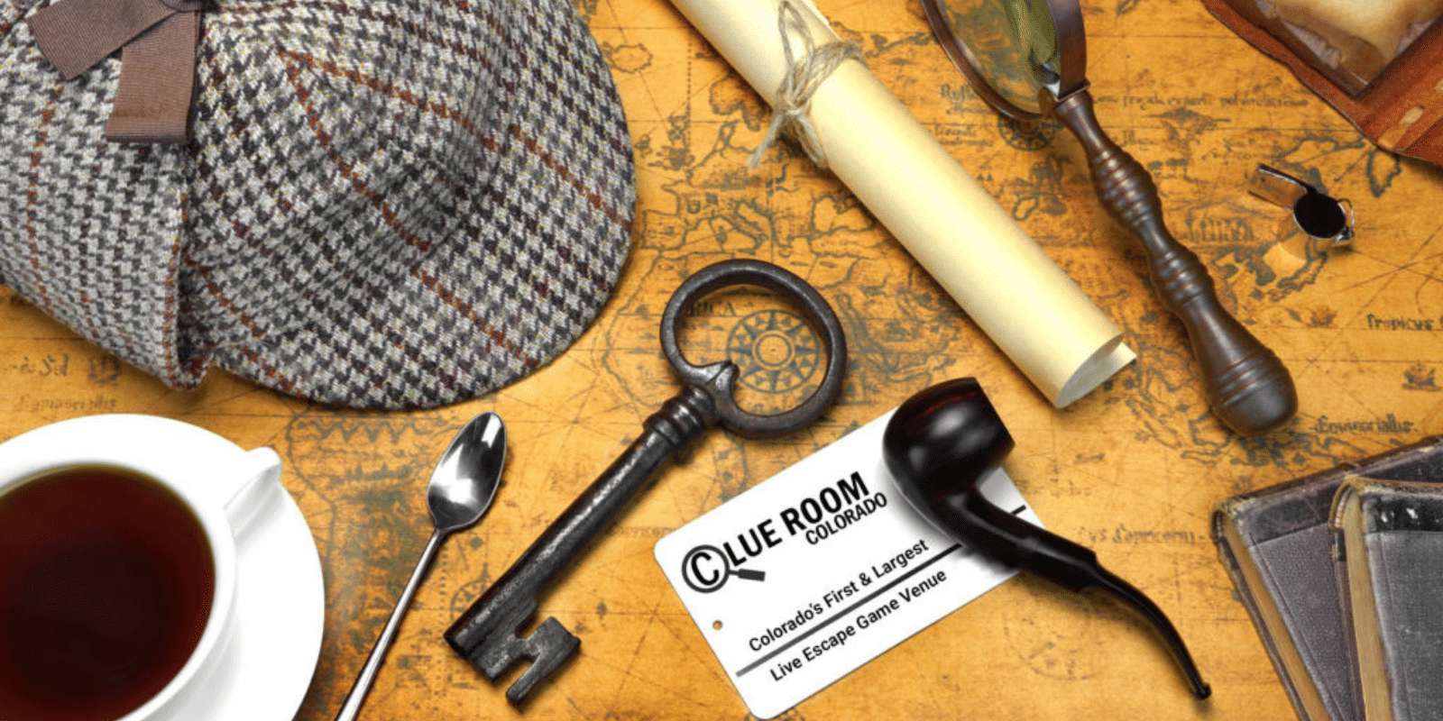 Image of a detective hat, pipe, magnifying glass, and key