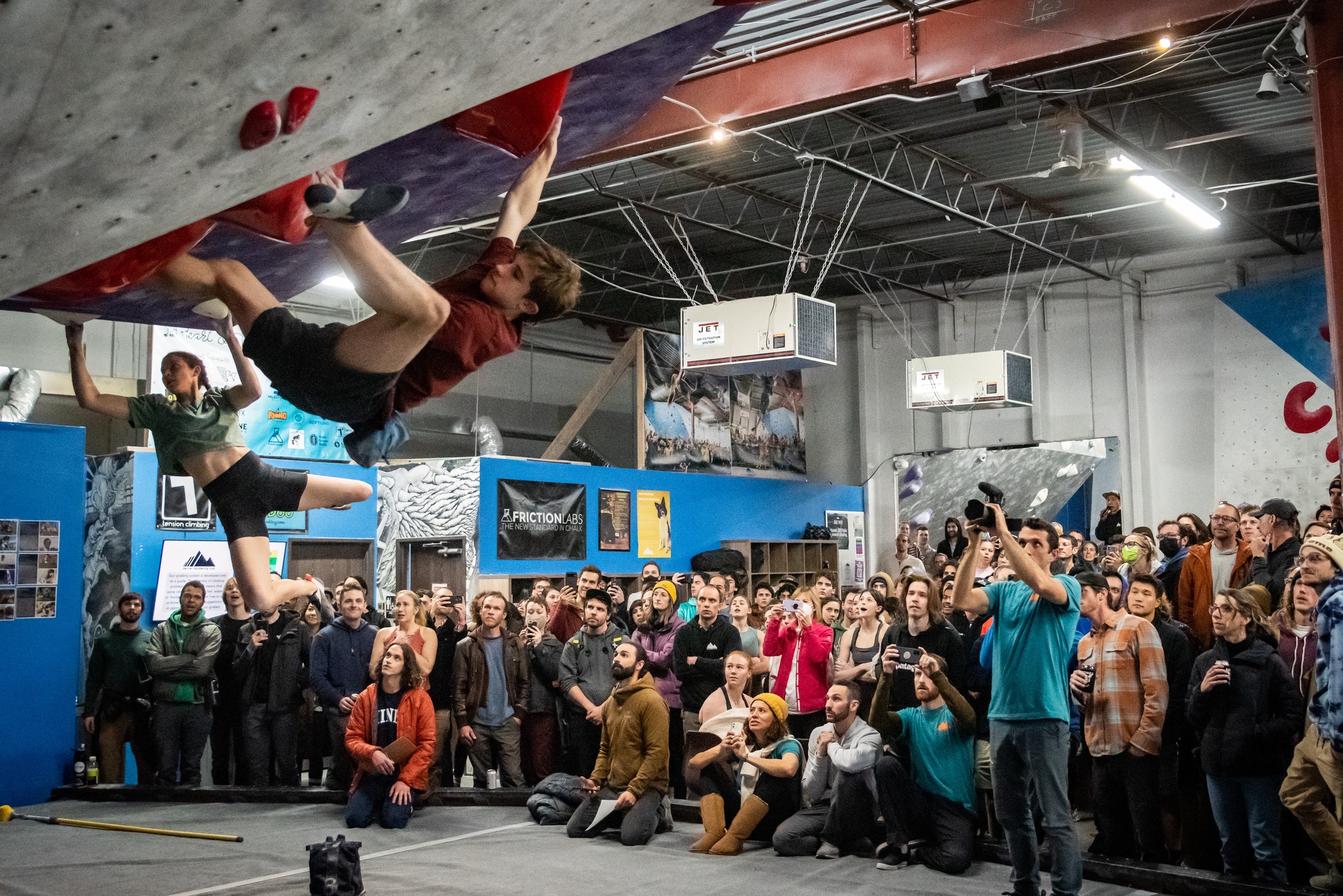 Image of climbers competing at the Denver Bouldering Club Central in Colorado