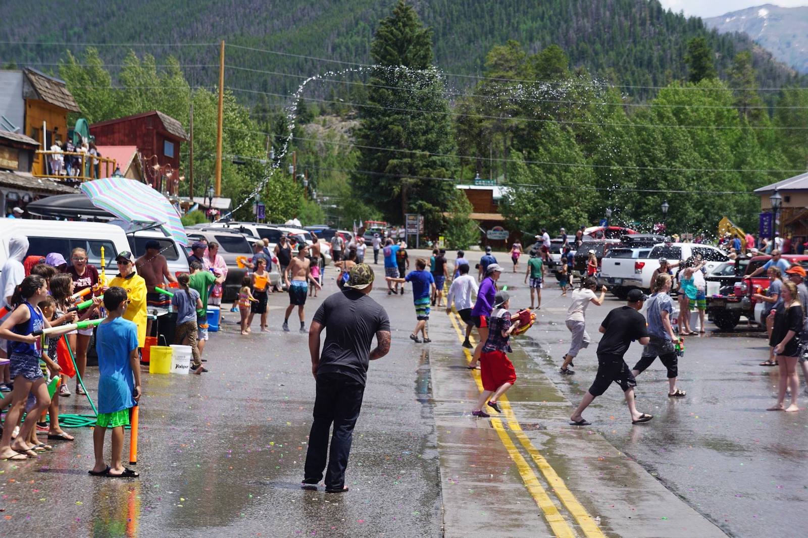 Image of people having a water balloon fight at Grand Lake's Buffalo Days in Colorado