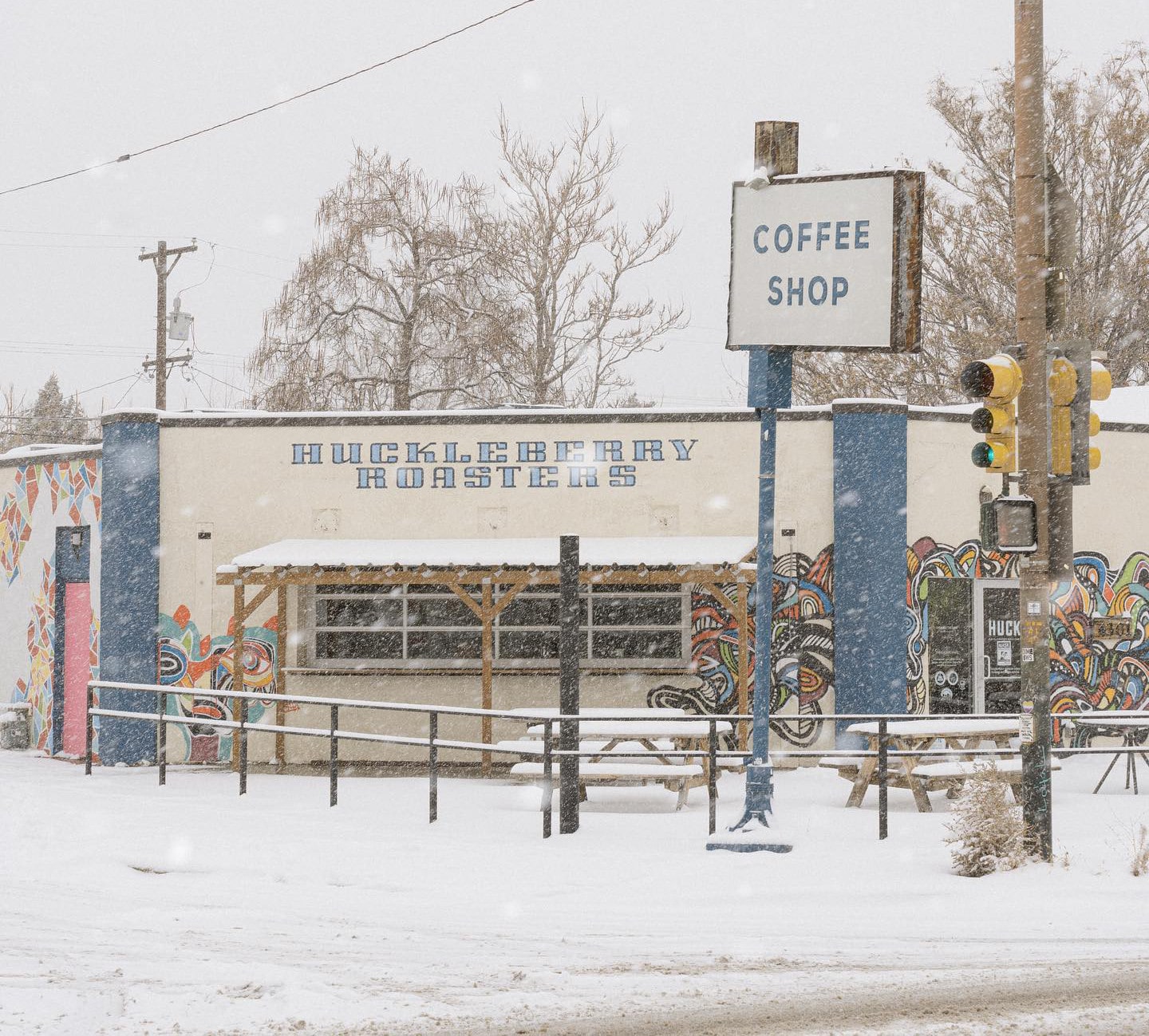 Image of snow falling at Huckleberry Roasters in Denver, Colorado