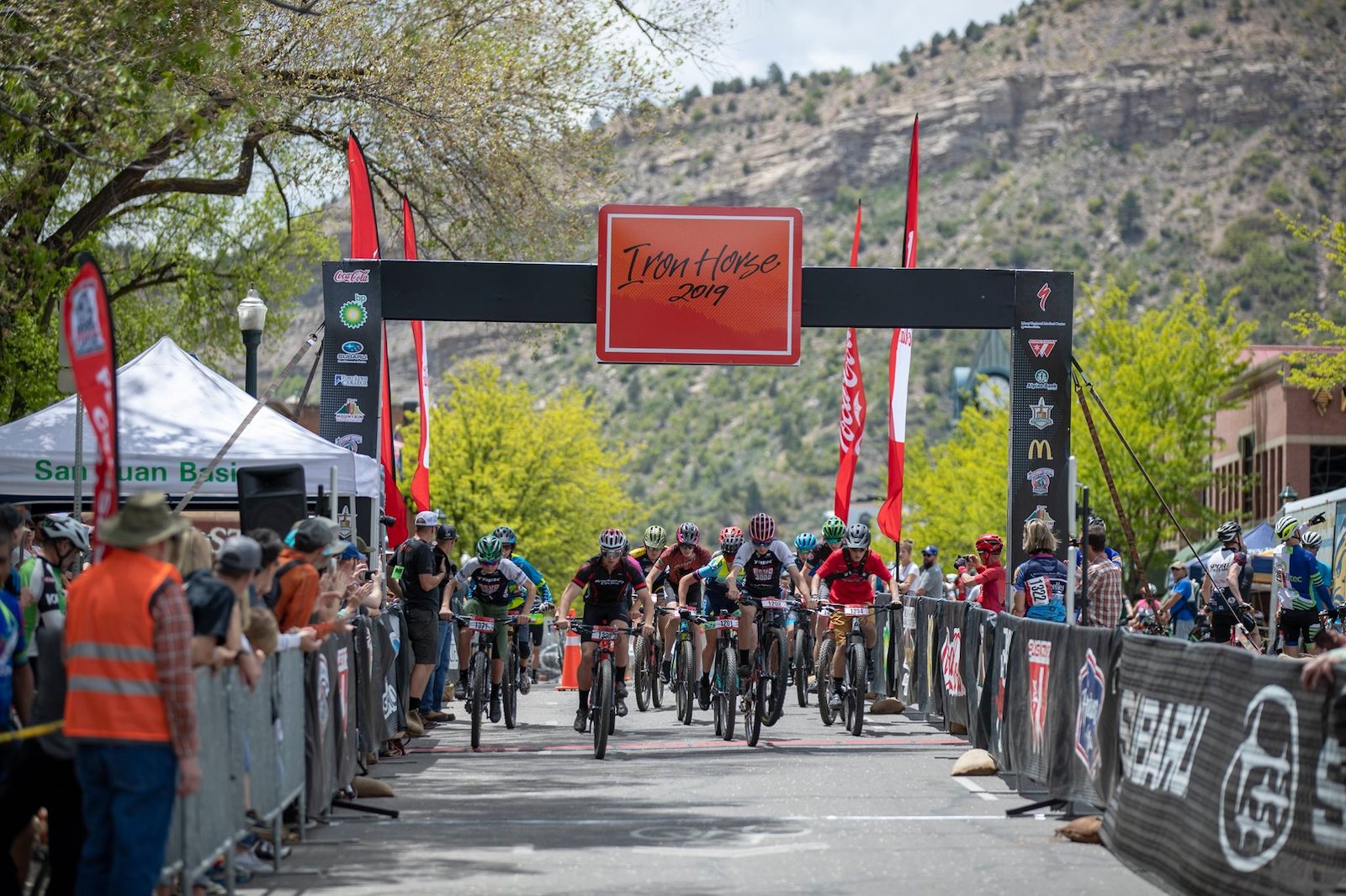 Image of bikers crossing the line at the 2019 Iron Horse in Durango