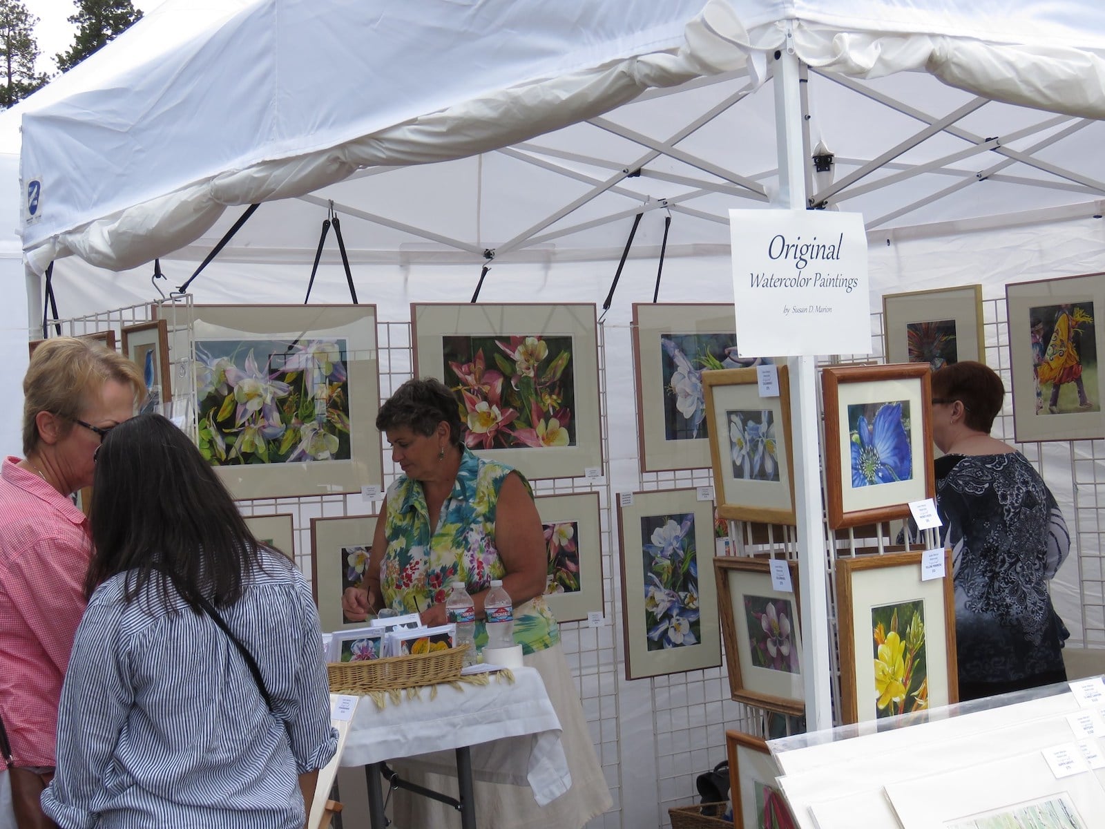 Image of a watercolor painting stall at the Mountain Arts Festival in Woodland Park, Colorado