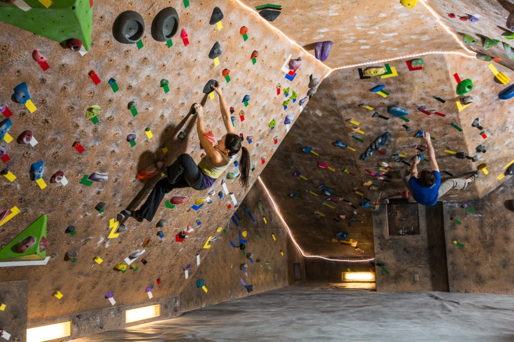 Image of a person bouldering at Rock'n & Jam'n indoor climbing gym in Denver, Colorado