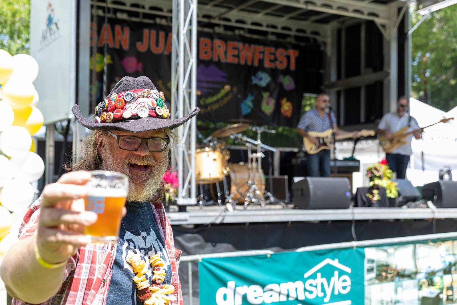 Image of a man enjoying a beer at the San Juan Brewfest in Durango, Colorado