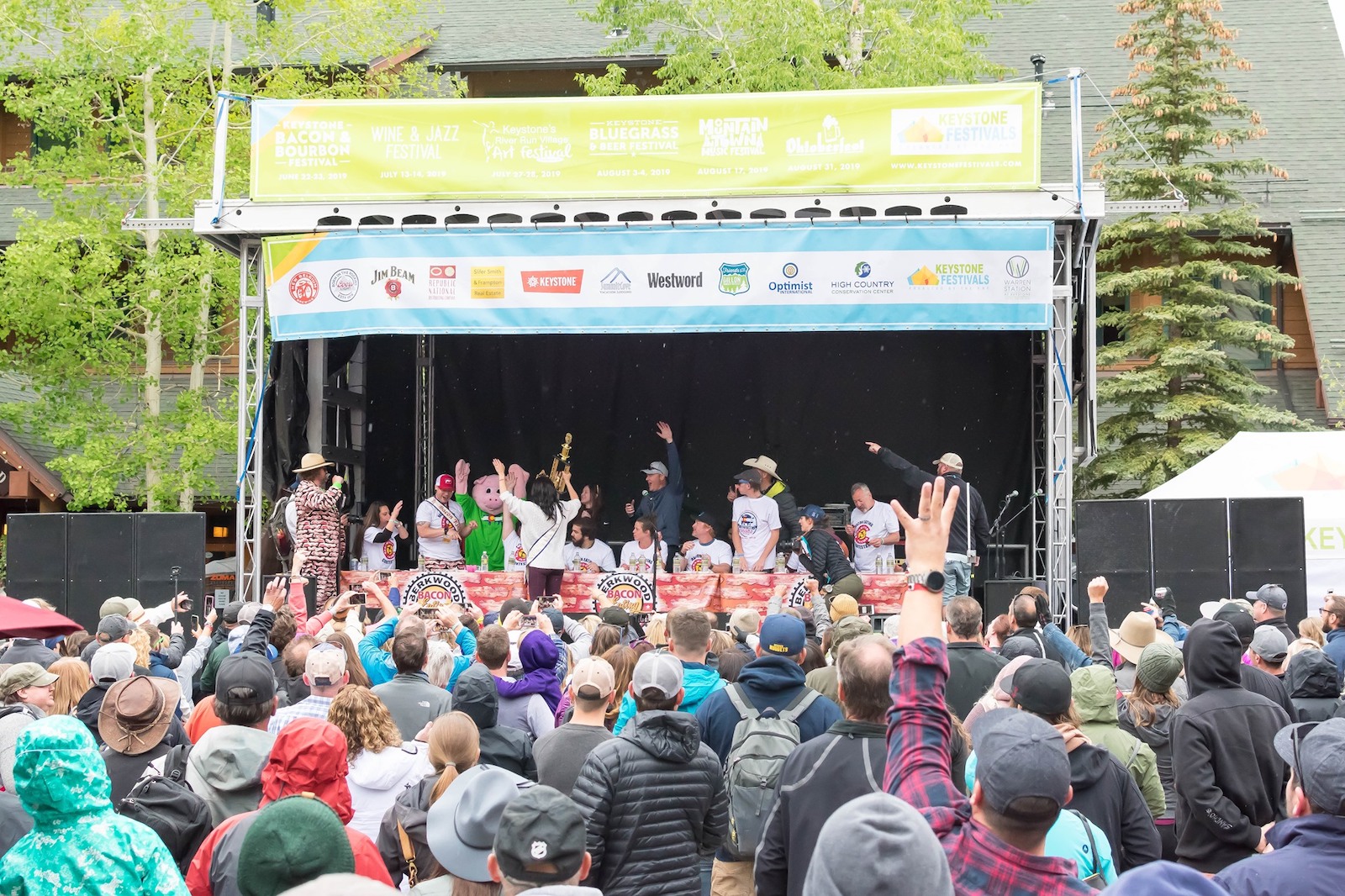 Image of a bacon eating contest at the Bacon and Bourbon Festival in Keystone, Colorado