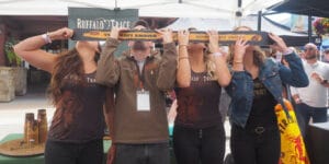 Image of people doing a skishot at the Breckenridge Hogfest: Bacon & Bourbon in Colorado