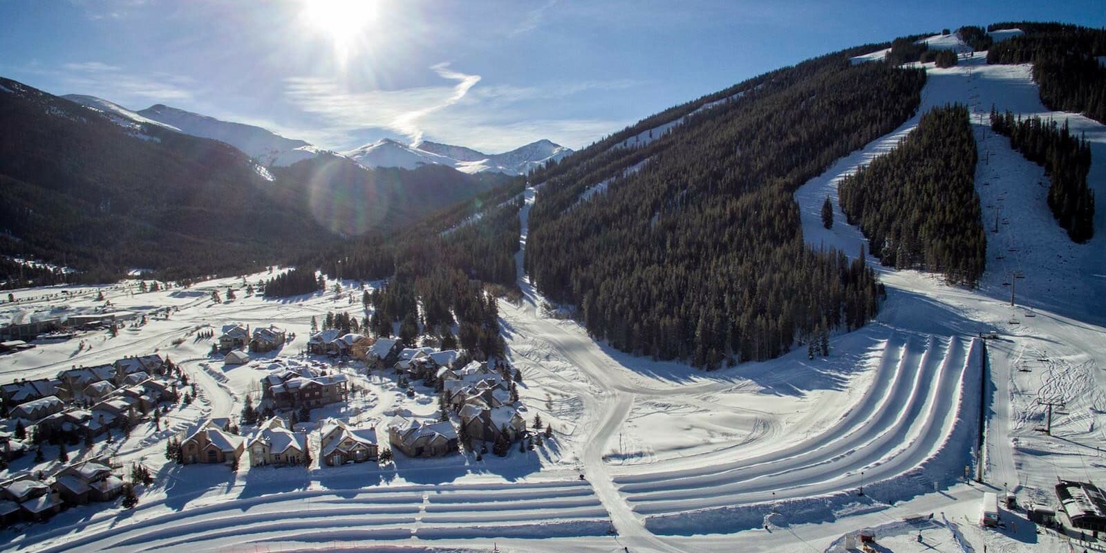 Which snow tubing hills are near what Colorado towns?