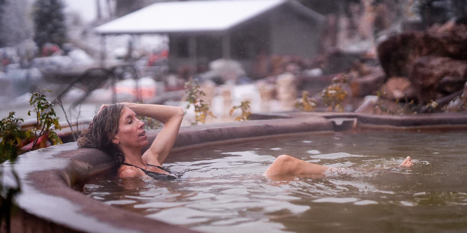 Image of a woman soaking in a mineral pool at the Durango Hot Springs Resort and Spa