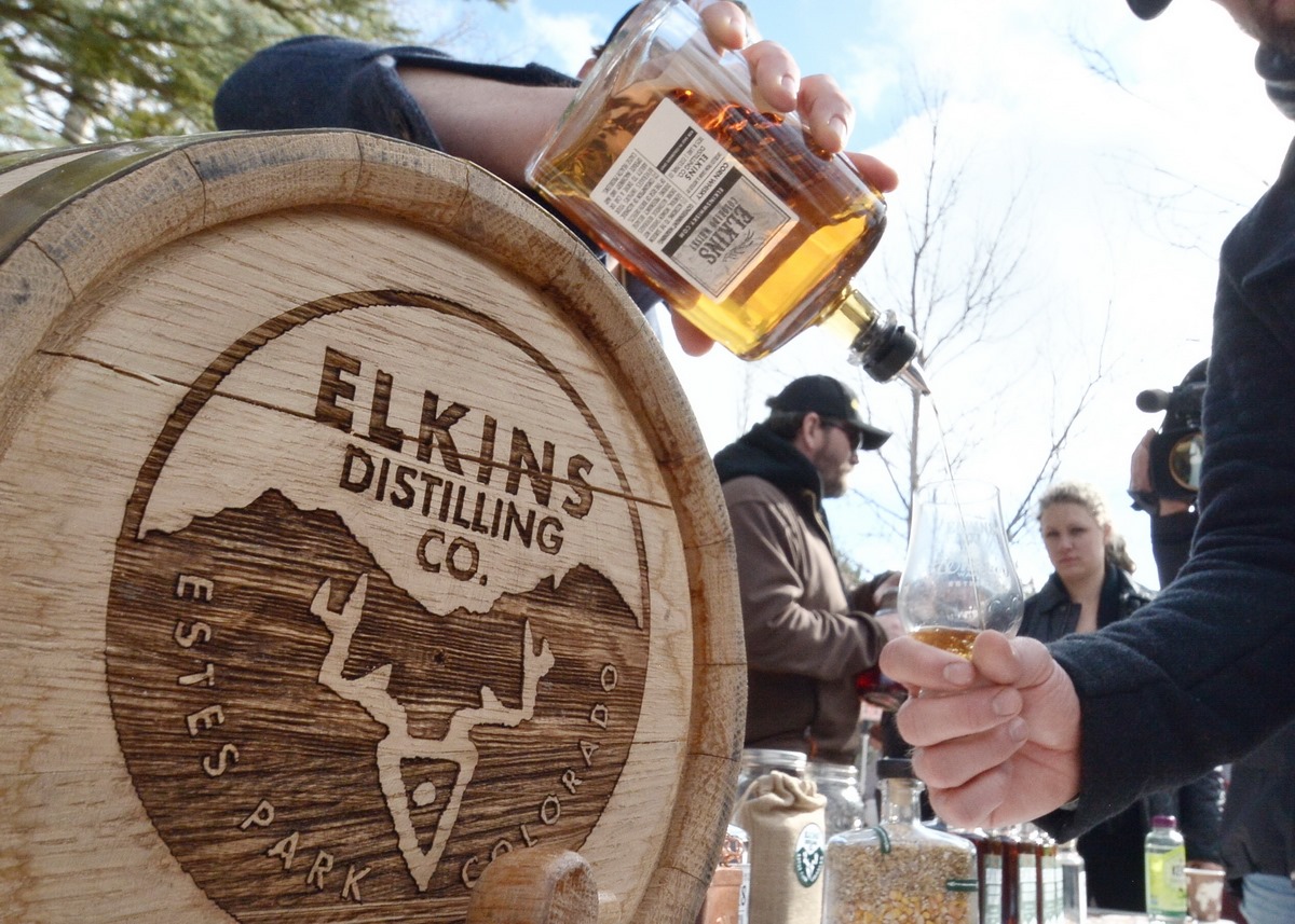 Image of whiskey being poured at the Whiskey Warmup in Estes Parks, Colorado