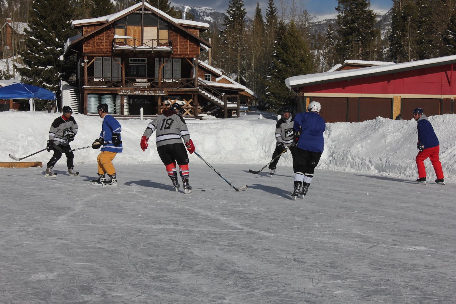 Image of people competing in the Grand Lake Pond Hockey Classic in Colorado