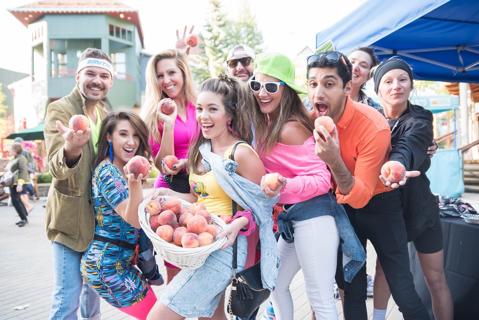 Image of people holding peaches at the Keystone Mountain Town Music Festival in Colorado