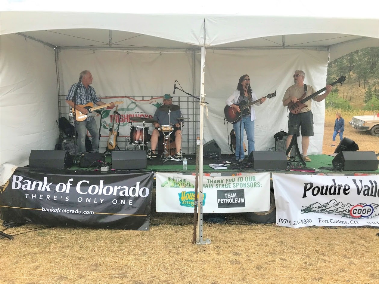 Image of a band playing at the Rist Canyon Volunteer Fire Department Mountain Festival in Bellvue, Colorado