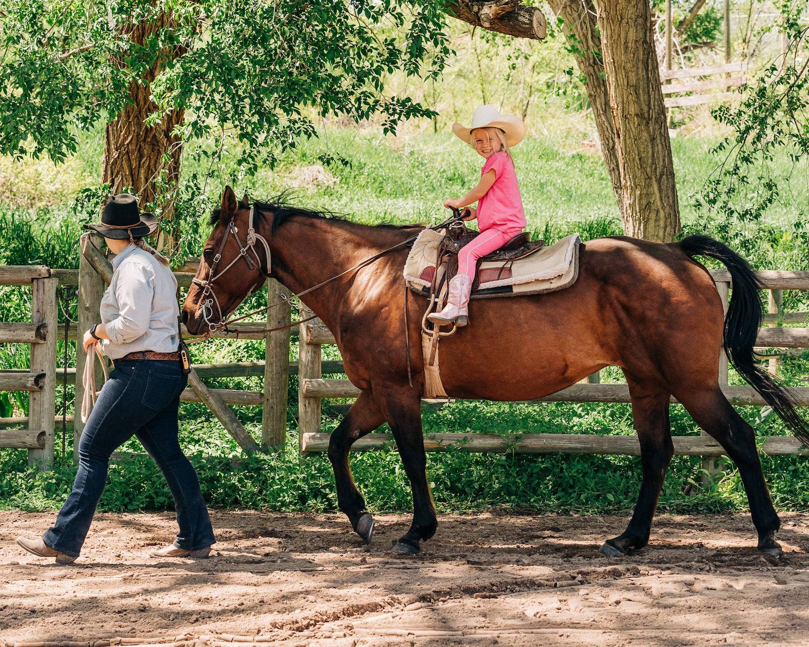 Image of a little girl riding a horse at Sylvan Dale Guest Ranch in Loveland, CO