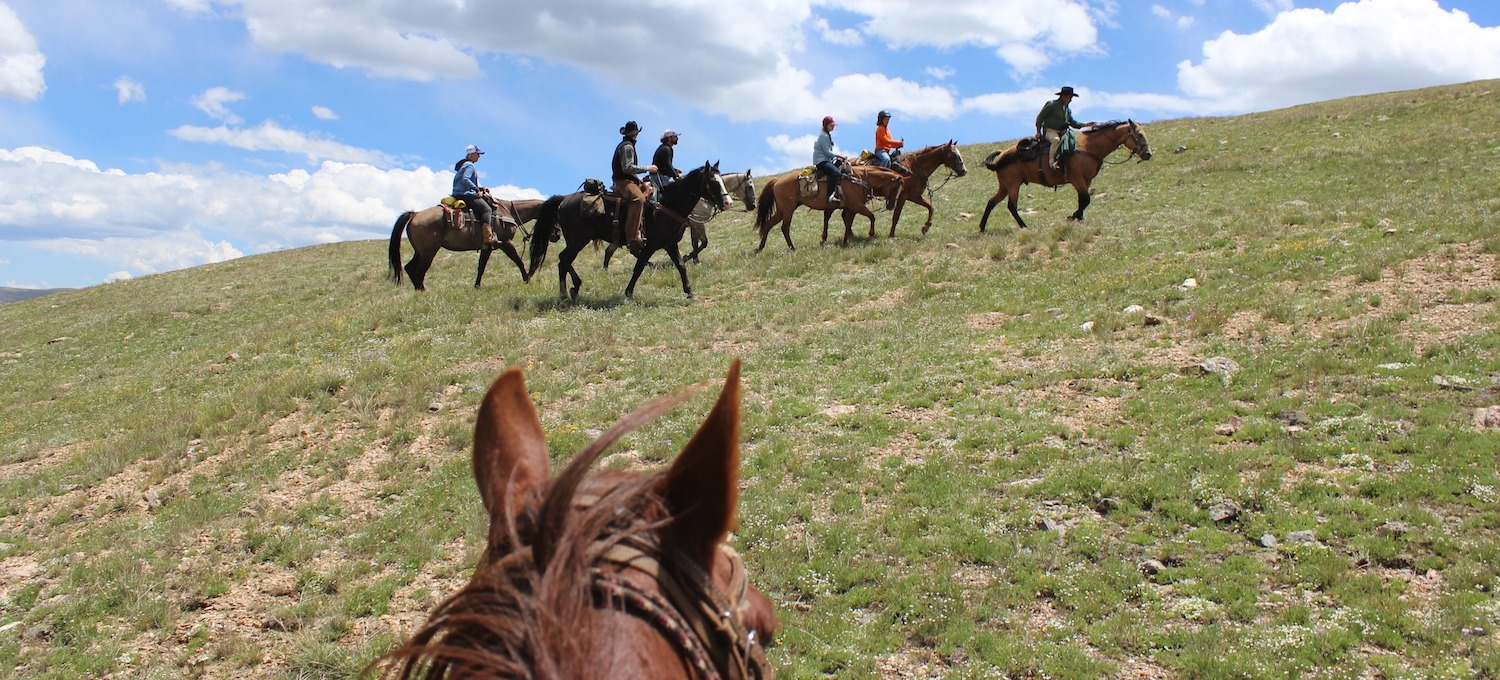 Image of people riding horses at Tumbling River Ranch in Grant, Colorado